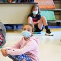 Fifth-graders wearing face masks sit at proper social distancing during a music class to avoid COVID-19 cases at the Milton Elementary School in Rye, N.Y.