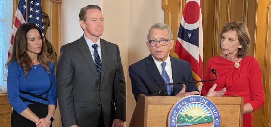 Flanked by their wives Tina and Fran, who are with them as they get ready for the weekend's inaugural activities, Lt. Gov. Jon Husted and Gov. Mike DeWine take questions about House Bill 45, which DeWine signed on January 6, 2023