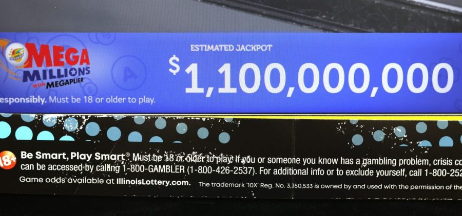 A ticket machine displays the projected jackpot of 1,100,000,000 for a Mega Millions drawing in Chicago, in early January.