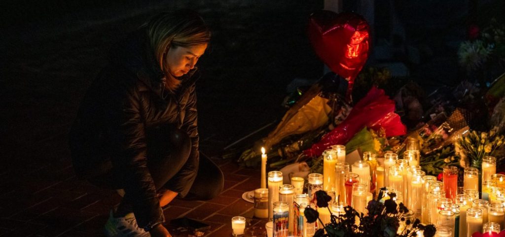 A mourner attends a candlelight vigil for victims of a mass shooting on January 23, 2023 in Monterey Park, California.