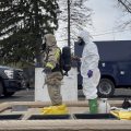 ONG 52nd Civil Support Team members prepare to enter an incident area to assess remaining hazards with a lightweight inflatable decontamination system (LIDS) in East Palestine, Ohio, Tuesday, Feb. 7, 2023.