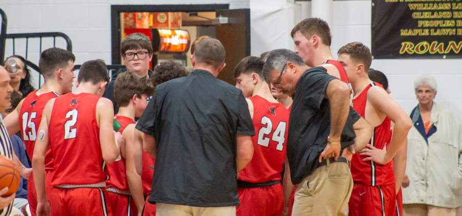 The Alexander Spartans huddle up during a time-out against the Meigs Marauders