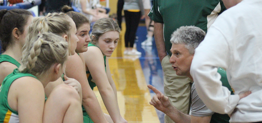 Eastern Lady Eagles Head Coach Jay Reynolds talks it over with his team before their matchup with Paint Valley