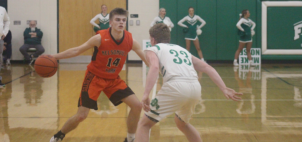 Nelsonville-York's Kegan Swope makes a move against the Fairland Dragons defender
