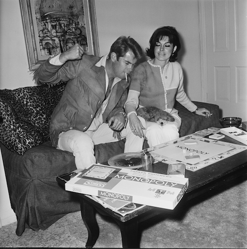 Actor Troy Donahue playing Monopoly at home in Beverly Hills, California, with his wife Valerie Allen. Circa 1967.