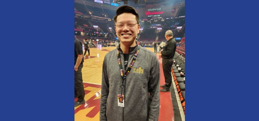 Nick Langer standing on CAVS court