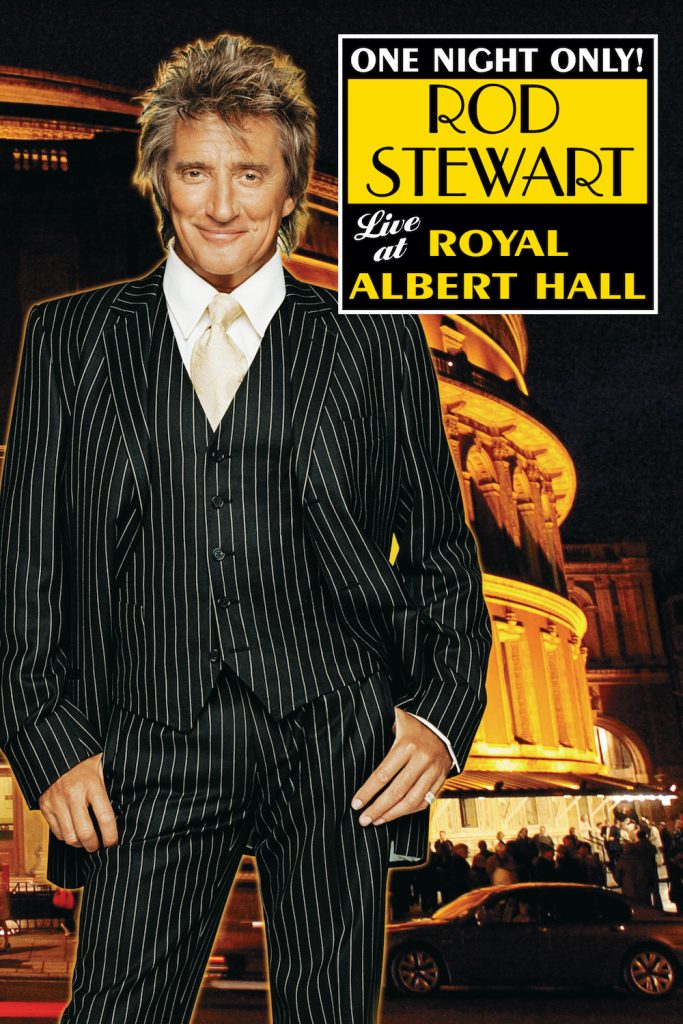 An image of Rod Stewart against the backdrop of a concert hall. He is wearng a black and white pinstripe suit.