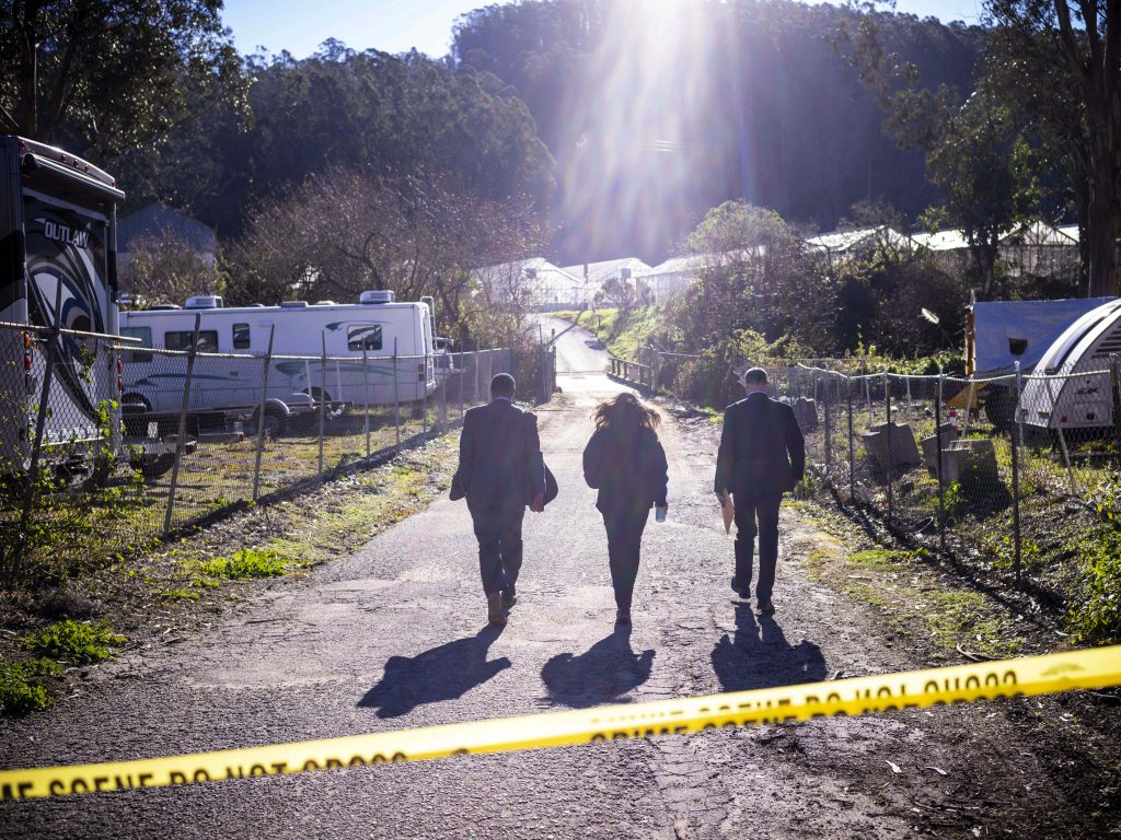 FBI officials walk towards the crime scene at Mountain Mushroom Farm on Jan. 24, after a gunman killed several people at two agricultural businesses in Half Moon Bay, Calif.