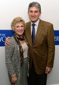 Joe Manchin puts his arm around his wife, Gayle Manchin, for a picture at an event for The New Yorker