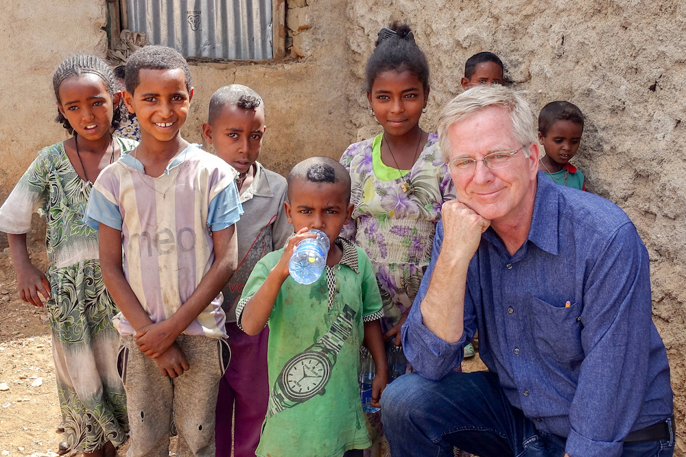 An image of Rick Steves with young Ethiopian children. 