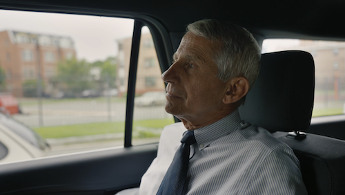 Dr. Tony Fauci sitting in car looking out window
