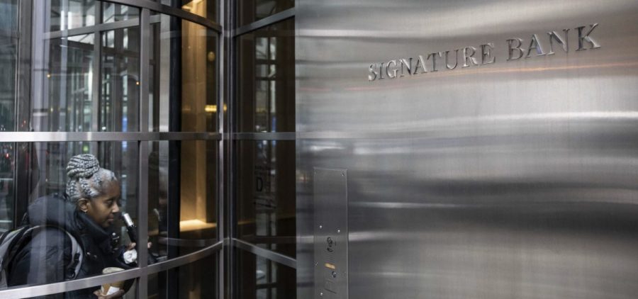 A person enters the Signature Bank headquarters in New York on March 13.