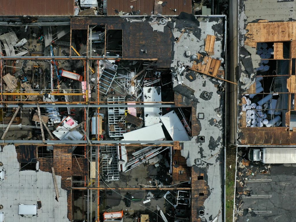 An overhead shot show the roof torn off a building in the city of Montebello.