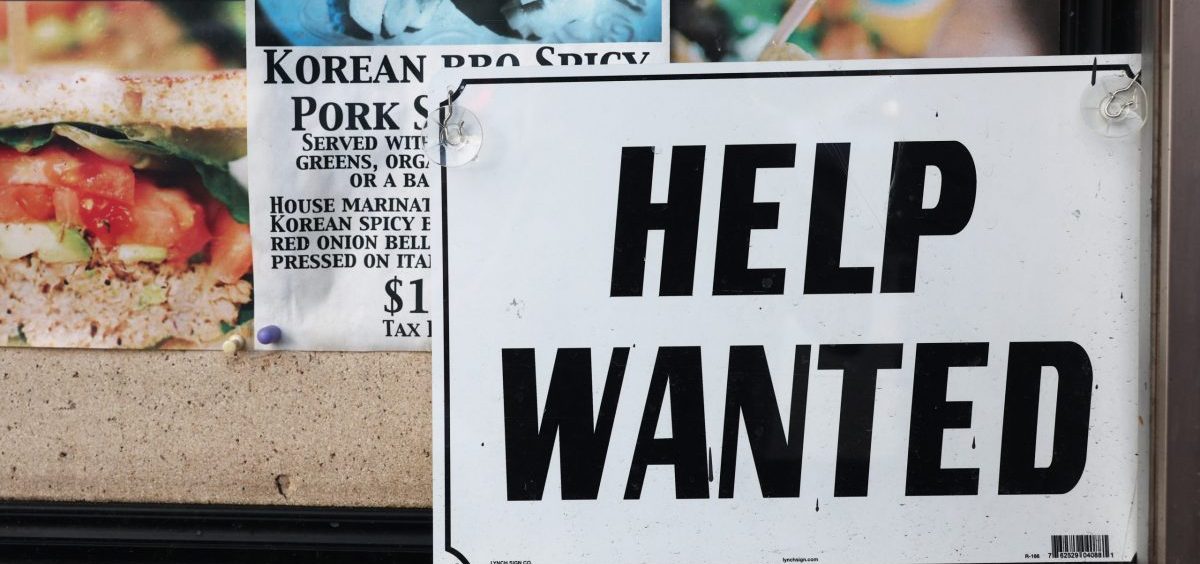 A "Help Wanted" sign is posted at a restaurant in Los Angeles