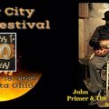A promotional image for the River City Blues Festival, depicting a moon and also a man playing guitar.