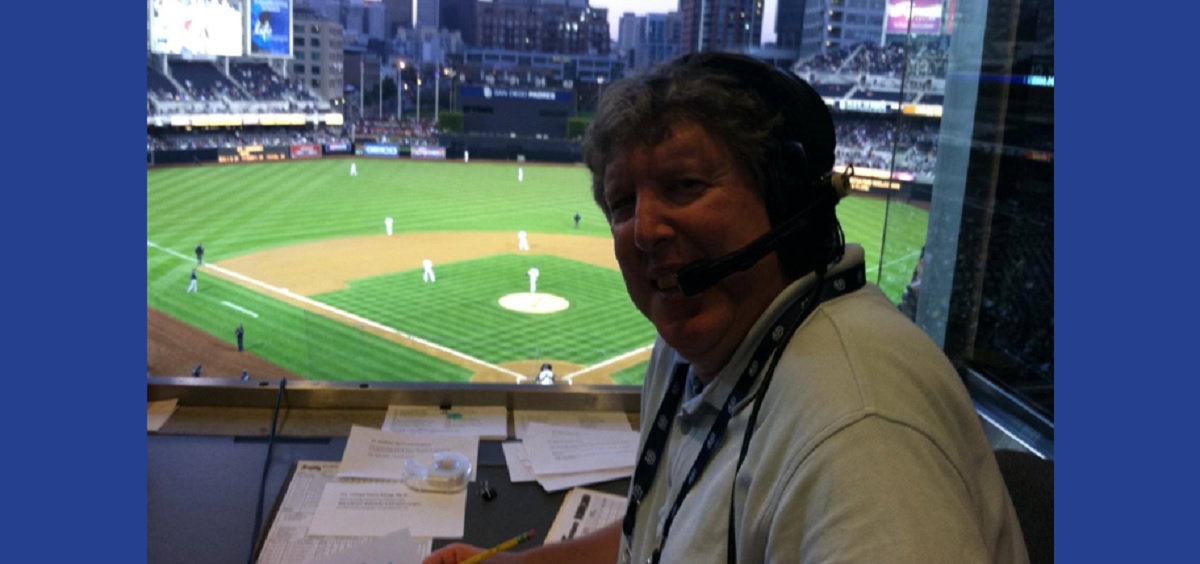 Alan Leventhal in booth at baseball game