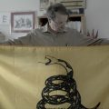 Peter Ansoff, shown holding a Gadsden Flag, is the President of the North American Vexillological Association.