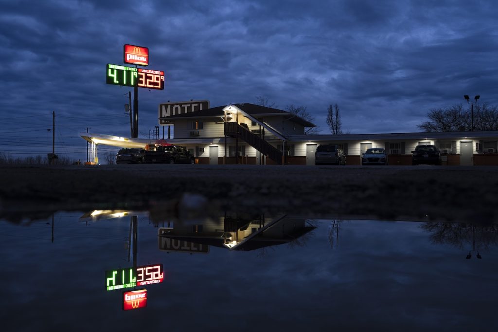 Lights are reflected from the Davis Motel, where several people displaced by the East Palestine train derailment are living, in North Lima, Ohio.