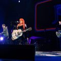 An image of Wynonna Judd performing on stage.