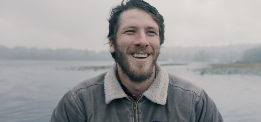 Close up of Man smiling while on a lake