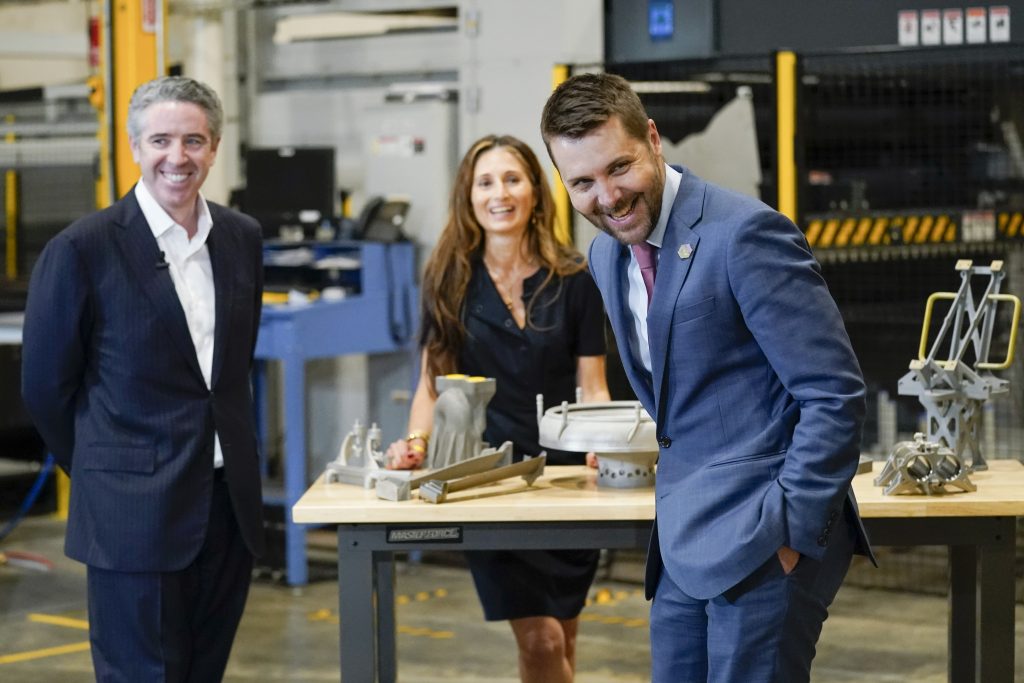 Brian Deese, center, awaits the arrival of President Biden on a May 6, 2022 tour of United Performance Metals in Hamilton, Ohio. Deese was Biden's top economic adviser until February. 