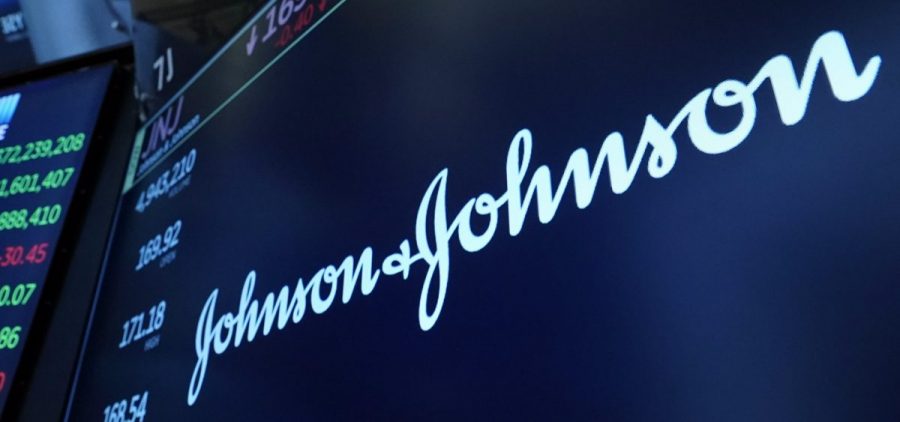 The Johnson & Johnson logo appears above a trading post on the floor of the New York Stock Exchange on July 12, 2021.