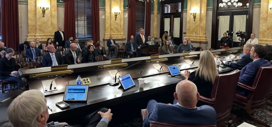 Norfolk Southern CEO Alan Shaw (center, at podium) takes questions from members of the Ohio Senate Select Rail Safety Committee about the derailment of one of his company's trains in East Palestine in February.