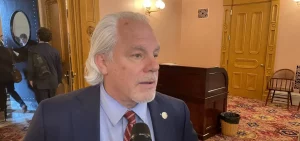 Rep. Phil Plummer, a supporter of Rep. Derek Merrin (R-Monclova Township) for speaker, talks to reporters after House session on January 25, 2023.