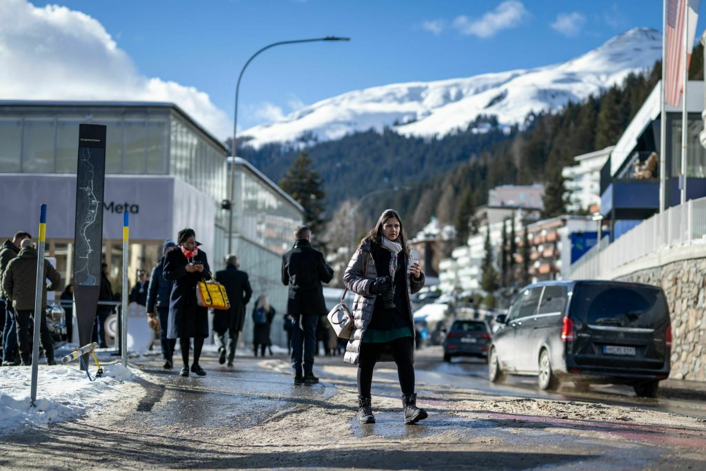 Participants walk in the street of the Alpine resort of Davos during the World Economic Forum annual meeting on Jan. 18. 