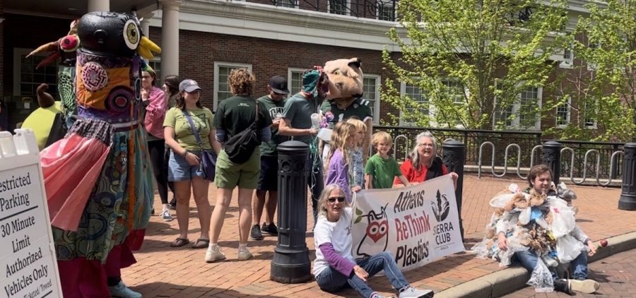 An image taken during Ohio University's Earth Day March on April 21, 2023. The picture depicts a group of people gathered outside of Ohio University's Baker Center holding signs about environmental issues.