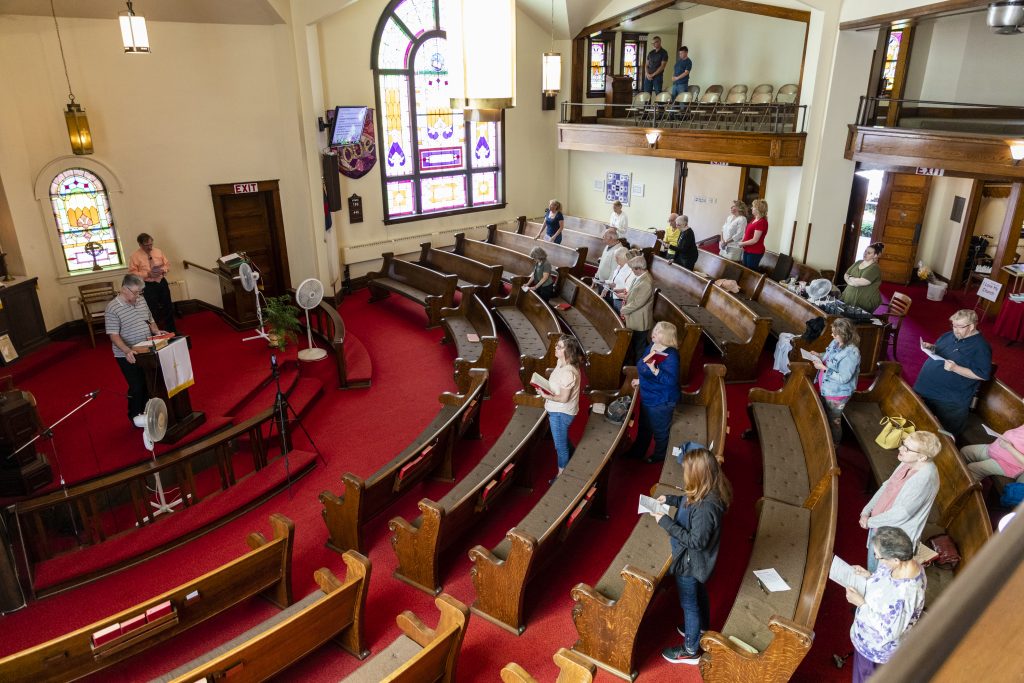Worshippers spread out in the sanctuary of Struthers United Methodist Church during the Mother's Day Sunday service, the second to last service for the church before closing.