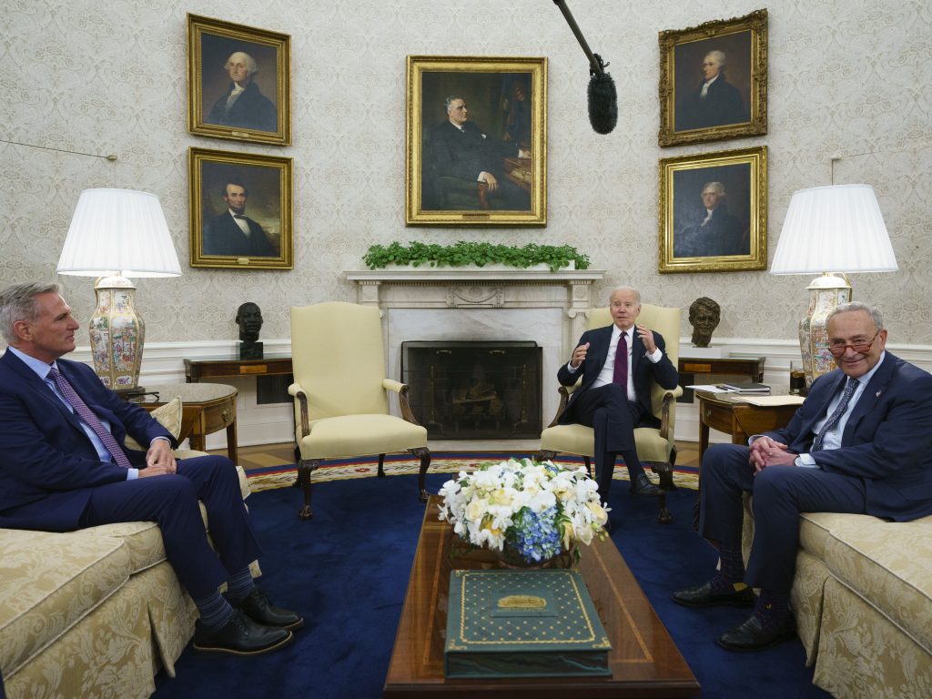 Speaker of the House Kevin McCarthy of Calif., left, and Senate Majority Leader Chuck Schumer of N.Y., right, listen as President Biden before an Oval Office meeting on the debt limit on May 9.
