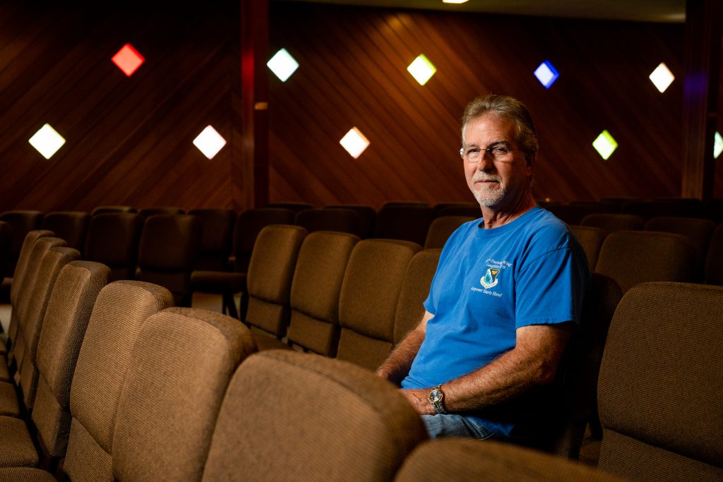 Dave Beasley at the Church of the Nazarene in Santa Cruz, Calif., on Monday sits in padded seats set up in rows at the church.