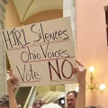 A homemade sign reads HJR1 Silences Ohio Voices Vote No as protestors oppose the resolution in the state capitol