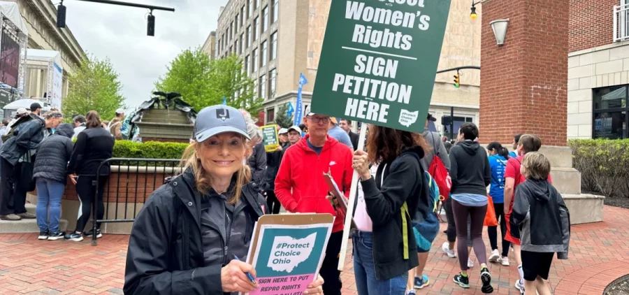 Supporters of abortion rights gather signatures at a race in downtown Columbus.