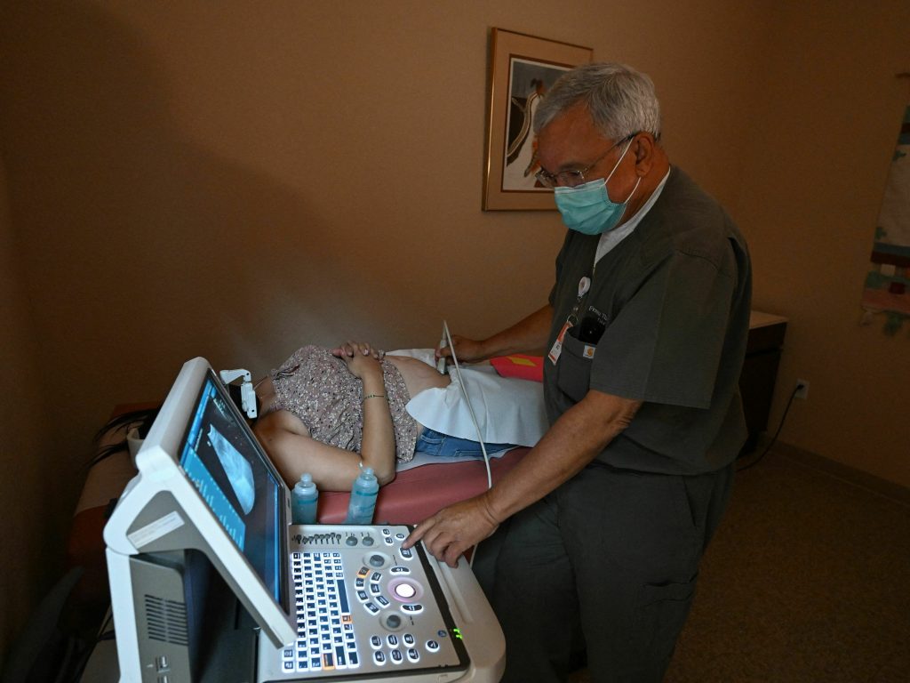 Dr. Franz Theard performs a sonogram on a patient seeking abortion services at the Women's Reproductive Clinic in Santa Teresa, New Mexico
