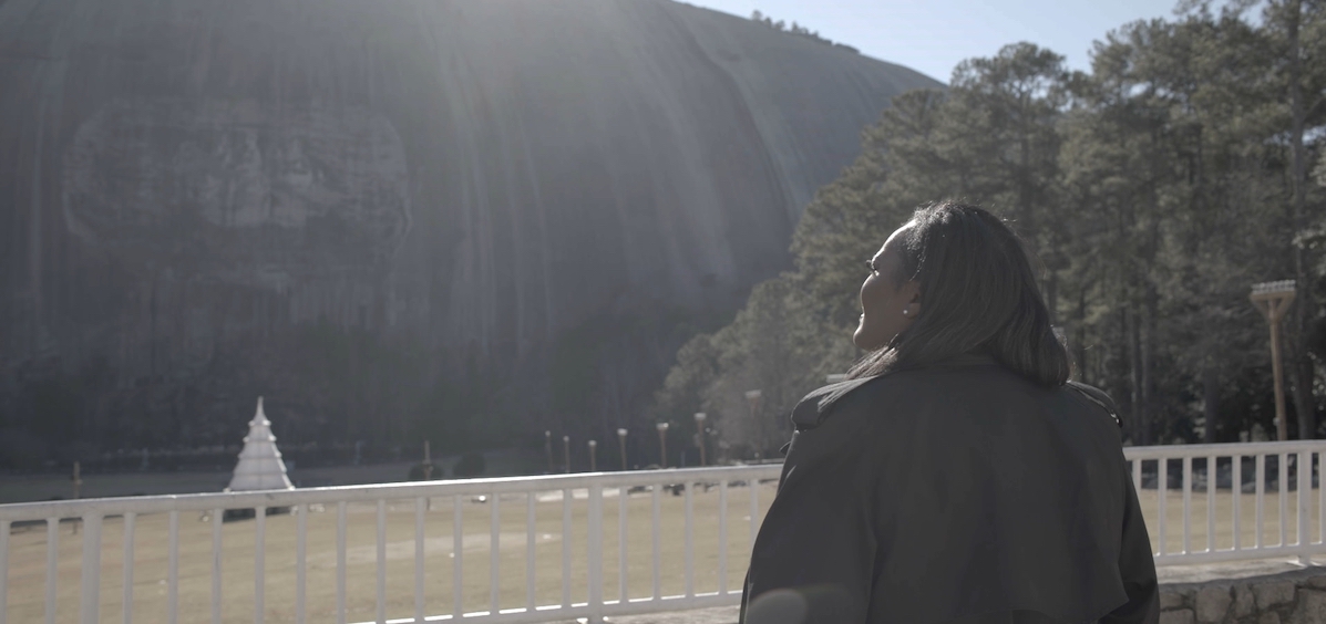 Derrica Williams staring up at Stone Mountain