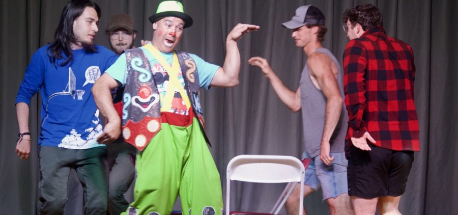 A Lewis and Clark Circus performer plays a game of musical chairs with audience members.