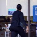 A woman walks past a personal finance loan office in October 2020 in Franklin, Tenn.