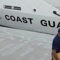 The U.S. Coast Guard Cutter Warren Deyampert is docked as a member of the Coast Guard walks past, Tuesday, June 20, 2023