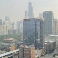 Haze from Canadian wildfires blankets the Chicago skyline as seen from the city's South Loop neighborhood