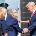 Former President Donald Trump shakes hands with Gov. Mike DeWine as he steps off Air Force One.