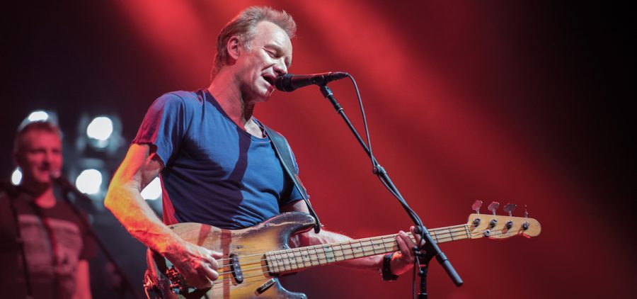 STING on stage playing guitar and singing in Paris, 2017. Photo by Fabrice Demessence
