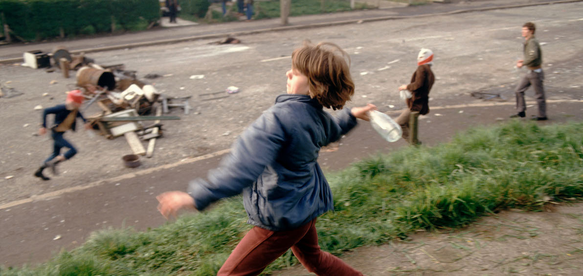 Girl throwing bottles at British troops during a riot in Belfast, Northern Ireland, in 1981.