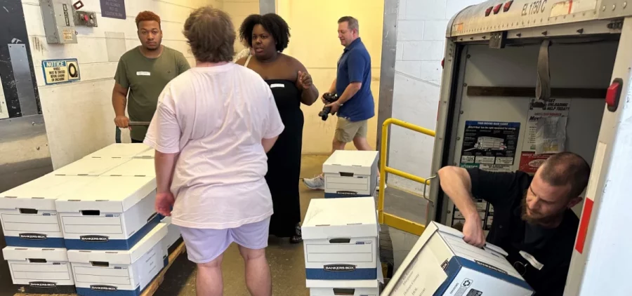 Supporters of a proposed law to regulate marijuana like alcohol in Ohio unload a U-Haul truck with hundreds of boxes of petitions to put the statute before voters in November.