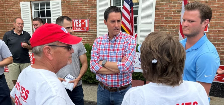 Republican Secretary of State Frank LaRose (center) talks to supporters of Issue 1 at a "get out the vote" rally at Ohio Republican Party headquarters on July 8, the Saturday before voter registration ends and early voting begins for the August 8 special election.