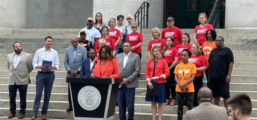 Columbus city leaders, Democratic state leaders and gun reform activists gather on the steps of the Ohio Statehouse to talk about the need for what they call common sense gun reforms.