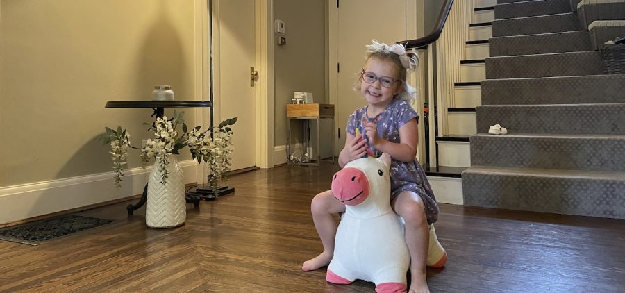 Brynn Schulte rides on a toy unicorn at her home in Cincinnati shortly before getting medication to treat her rare genetic bleeding disorder