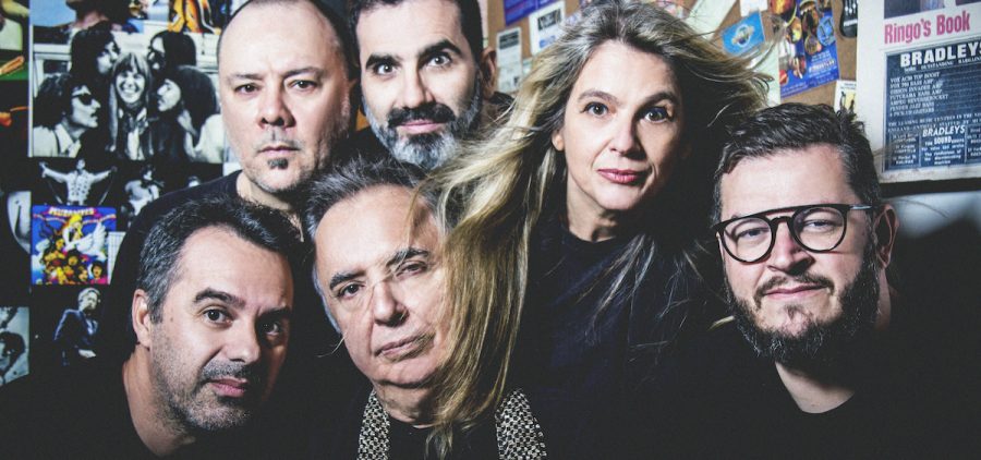 A promotional photo of Os Mutantes. All six members of the group are dressed in astronaut suits.