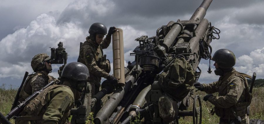 Ukrainian servicemen prepare to fire at Russian positions from a U.S.-supplied M777 howitzer in Kharkiv region, Ukraine, July 14, 2022.